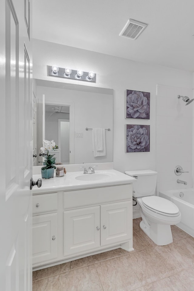 full bathroom with tile patterned floors, vanity, toilet, and tiled shower / bath