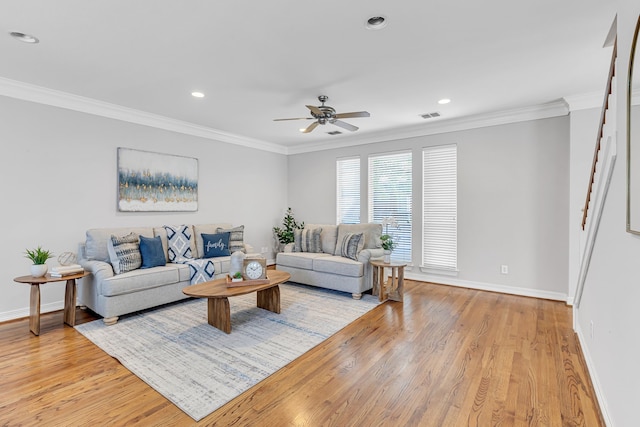 living room with ceiling fan, light hardwood / wood-style flooring, and ornamental molding