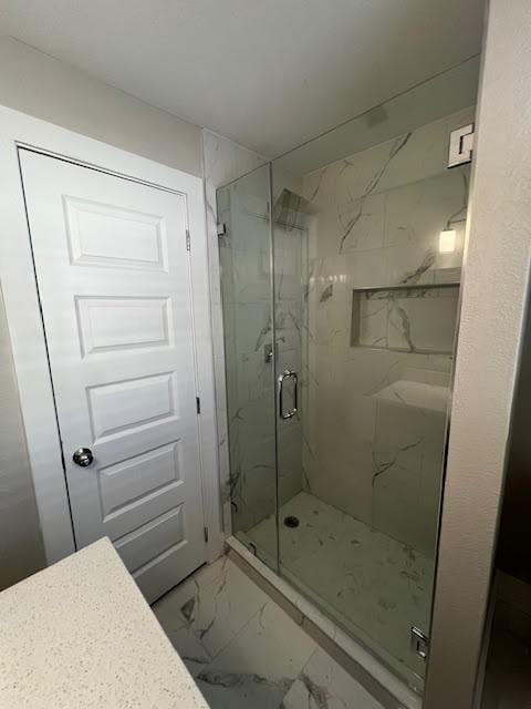 bathroom with an enclosed shower