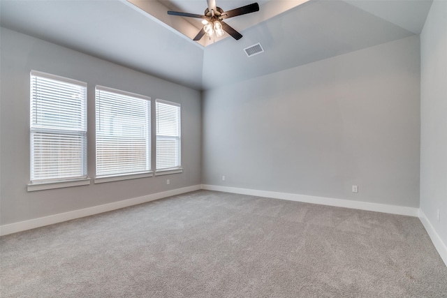 carpeted empty room with vaulted ceiling and ceiling fan