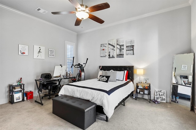 carpeted bedroom featuring ceiling fan and ornamental molding