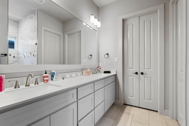 bathroom featuring tile patterned floors and vanity