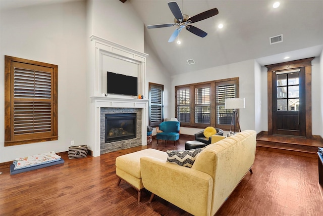 living room featuring ceiling fan, dark hardwood / wood-style flooring, and high vaulted ceiling