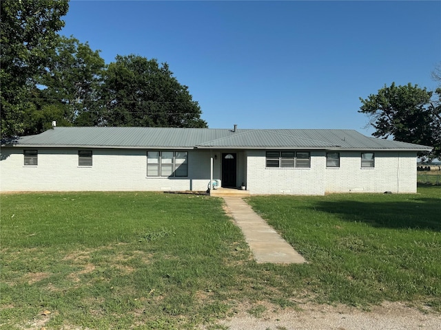 ranch-style home with a front lawn