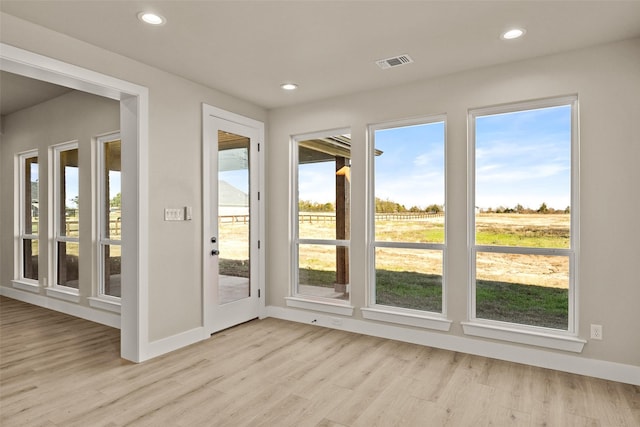 entryway featuring light wood-type flooring and plenty of natural light