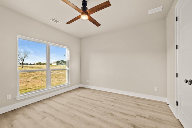 unfurnished room featuring ceiling fan and light hardwood / wood-style flooring