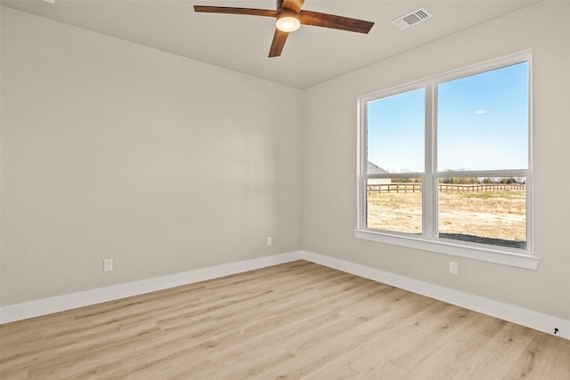 spare room featuring ceiling fan and light wood-type flooring