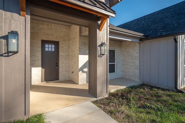 property entrance featuring a patio area