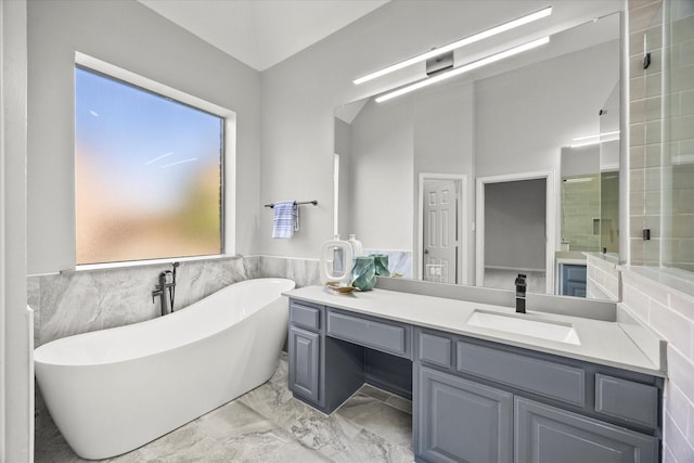 bathroom featuring vanity, tile walls, and separate shower and tub