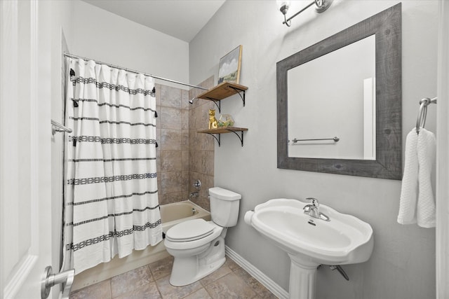 full bathroom featuring shower / bath combo, sink, and toilet