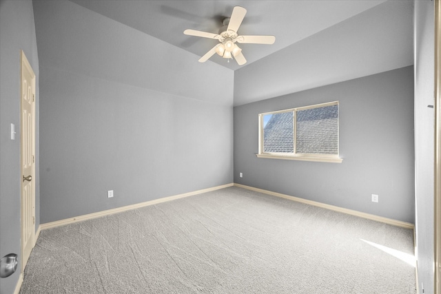 carpeted empty room featuring vaulted ceiling and ceiling fan