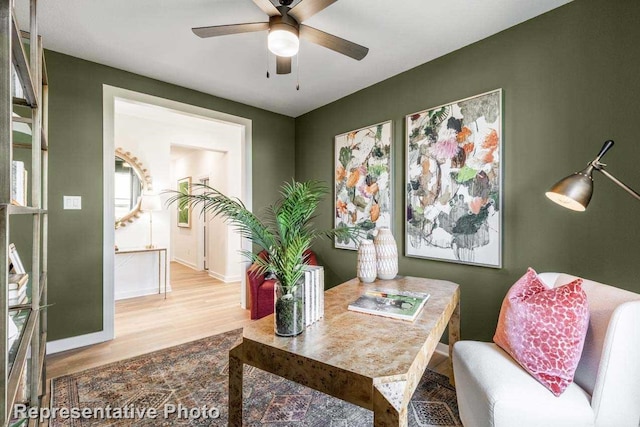 office space featuring ceiling fan and light hardwood / wood-style flooring