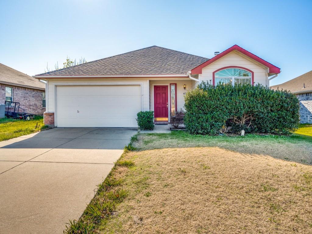 view of front facade with a garage and a front lawn