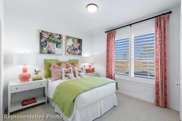 bedroom with light colored carpet