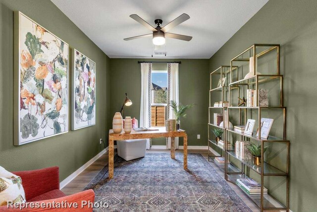 office area featuring ceiling fan and dark wood-type flooring