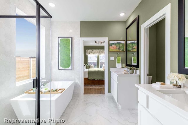 bathroom with vanity and a bathtub