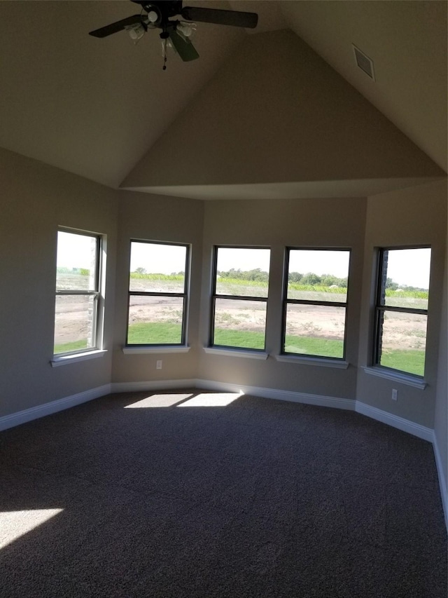 carpeted empty room featuring ceiling fan and lofted ceiling