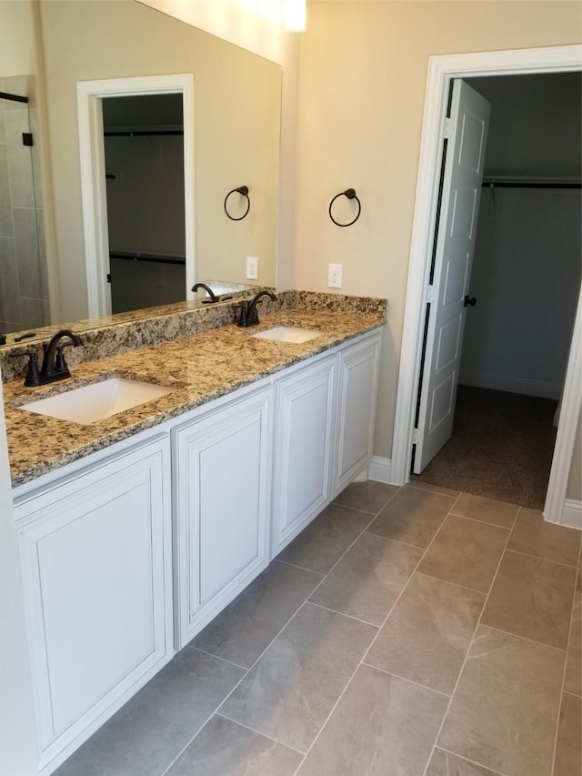 bathroom featuring tile patterned floors and vanity