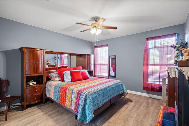 bedroom featuring ceiling fan and light wood-type flooring