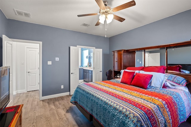 bedroom with ceiling fan, light hardwood / wood-style floors, and connected bathroom