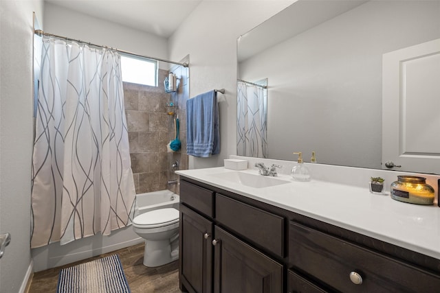 full bathroom with hardwood / wood-style floors, vanity, shower / bath combination with curtain, and toilet