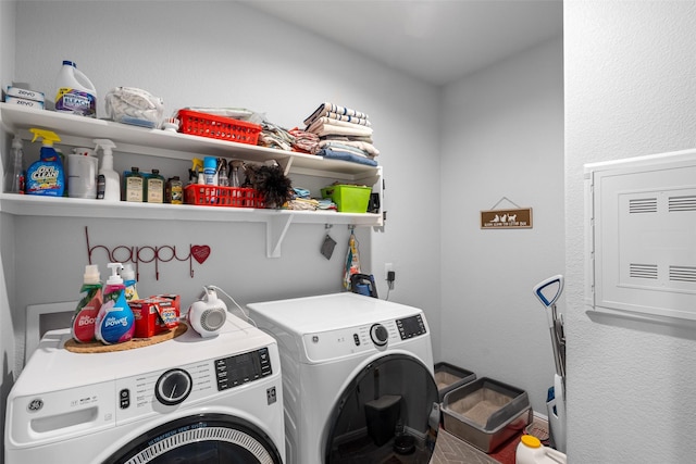 washroom featuring washing machine and clothes dryer