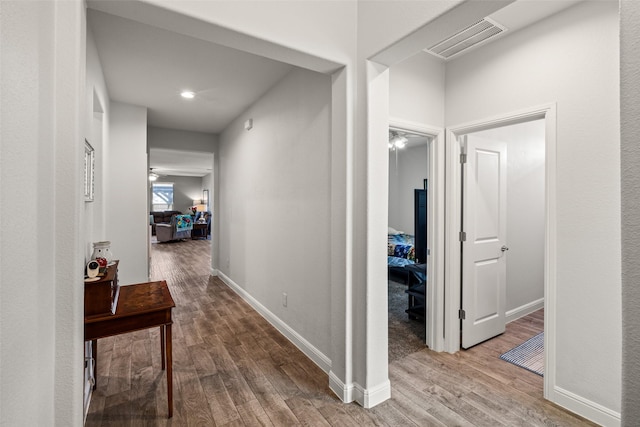 hall with wood-type flooring