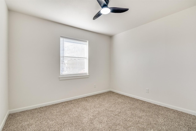 spare room featuring carpet flooring and ceiling fan