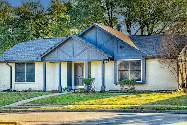 view of front of home with a front lawn