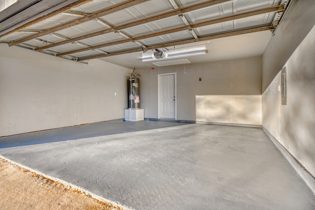 garage with water heater and a garage door opener