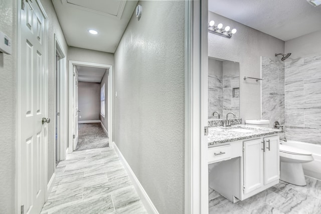 full bathroom with vanity, toilet, and tiled shower / bath