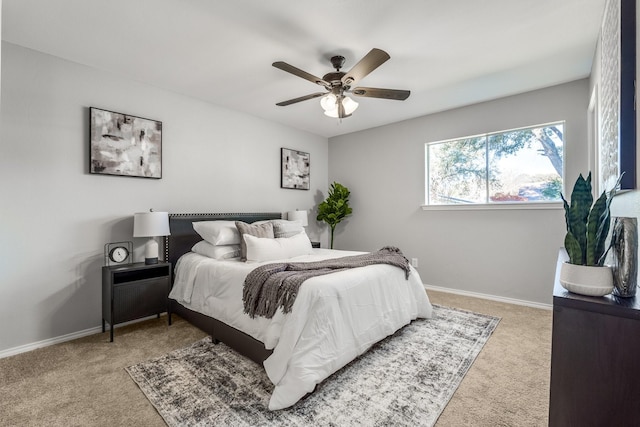 bedroom featuring ceiling fan and light colored carpet