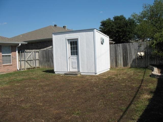 view of outdoor structure featuring a lawn