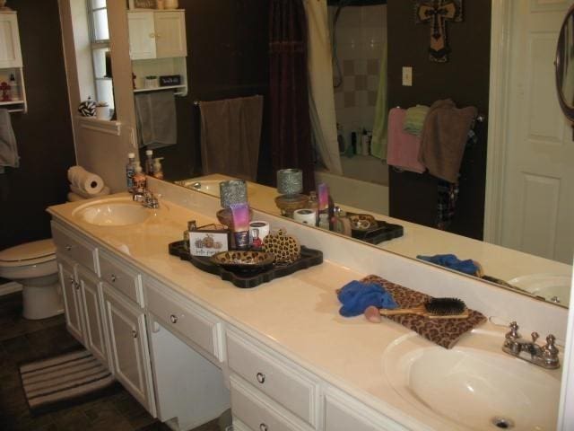 bathroom with vanity and toilet