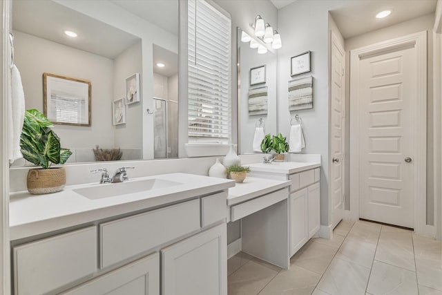 bathroom featuring tile patterned floors, recessed lighting, a shower stall, and vanity