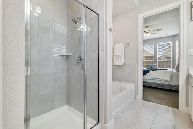 full bathroom featuring tile patterned flooring, connected bathroom, a garden tub, a stall shower, and a ceiling fan