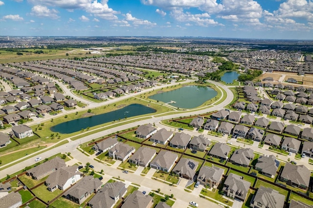 bird's eye view with a residential view and a water view