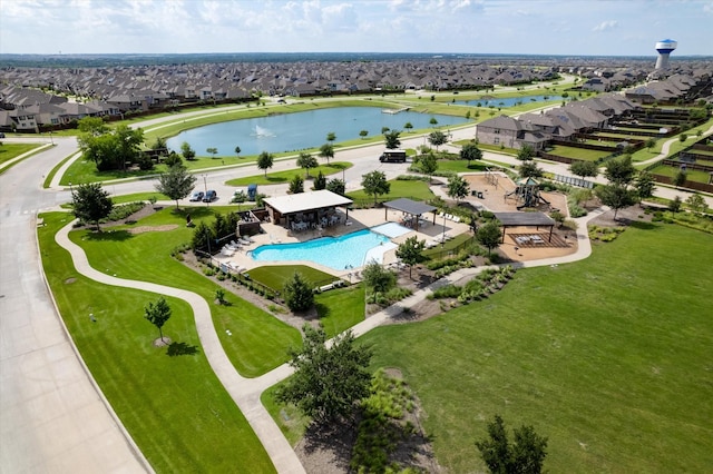 bird's eye view featuring a residential view and a water view