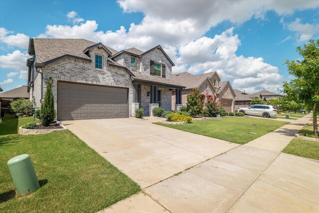 view of front facade featuring a garage and a front yard