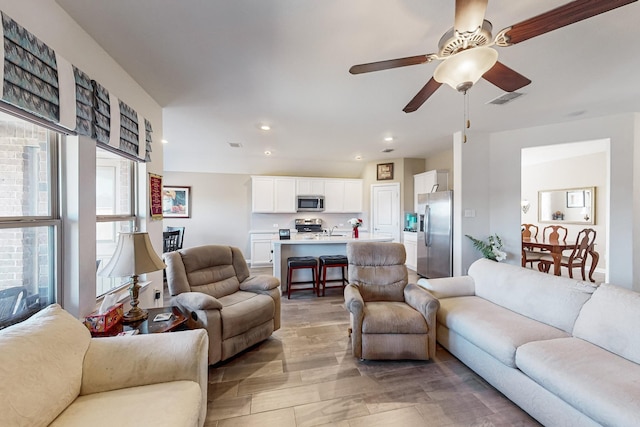 living room with ceiling fan