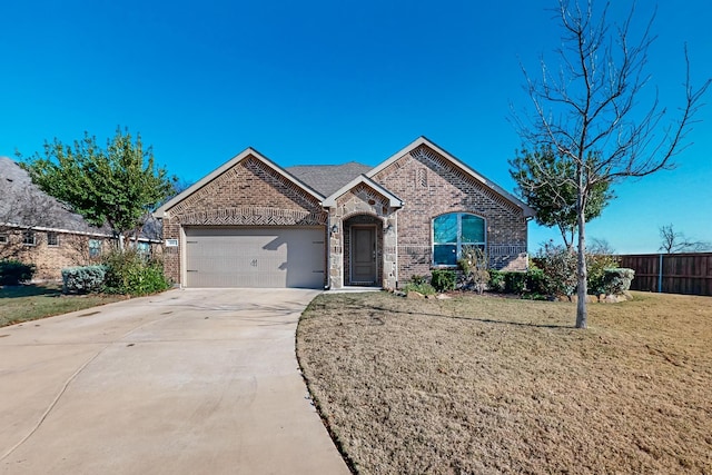 ranch-style home with a garage and a front yard