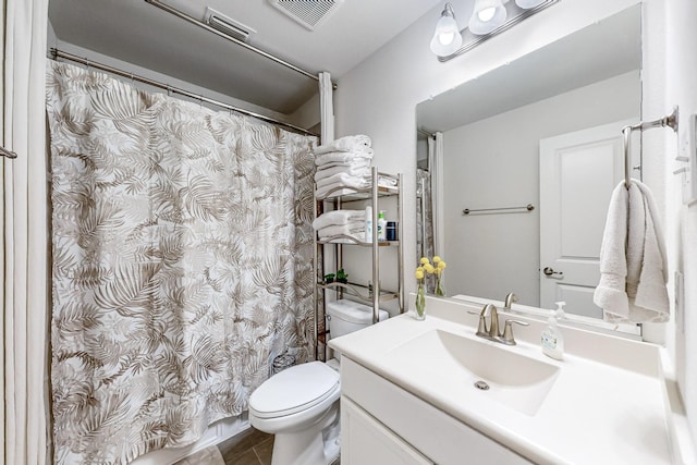 full bathroom featuring visible vents, toilet, vanity, and tile patterned floors