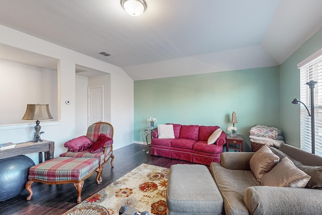 living room featuring vaulted ceiling and dark wood-type flooring