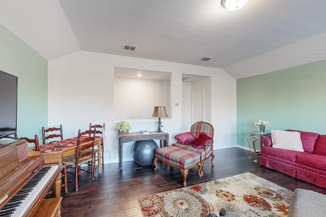 living room with dark hardwood / wood-style floors and vaulted ceiling