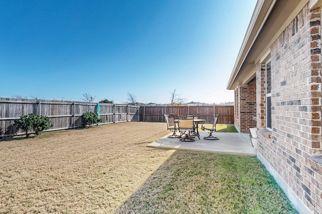 view of yard featuring a fenced backyard and a patio