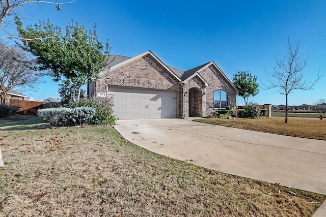 ranch-style home featuring a front lawn and a garage