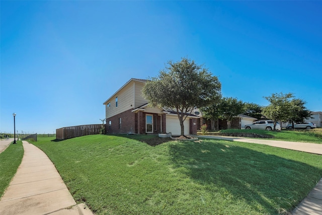 view of side of property with a lawn and a garage