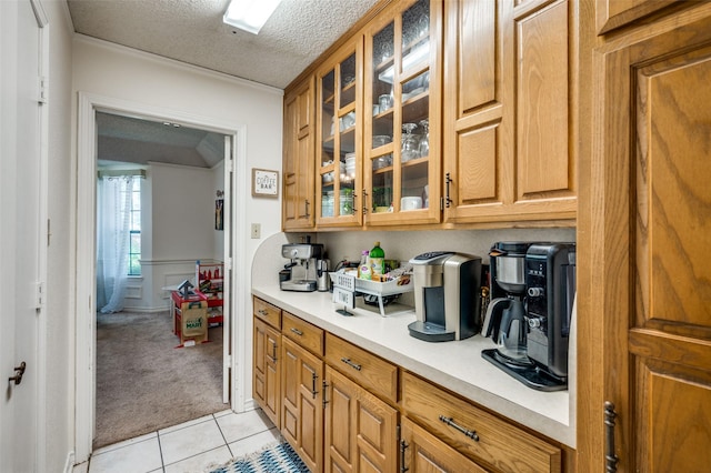 kitchen with light tile patterned floors and a textured ceiling