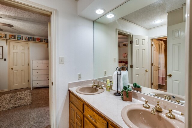 bathroom with vanity and a textured ceiling