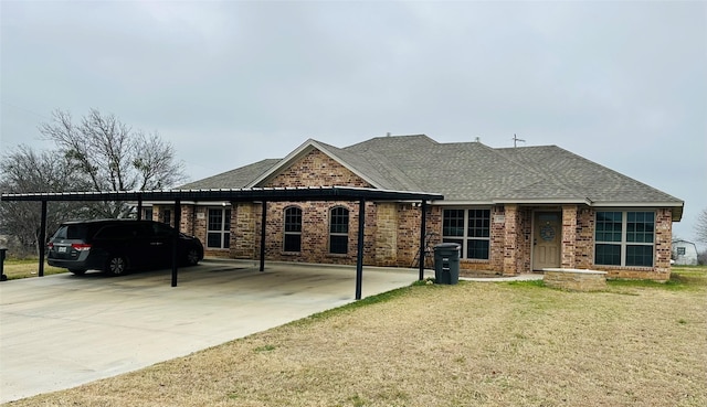 single story home featuring a carport and a front lawn